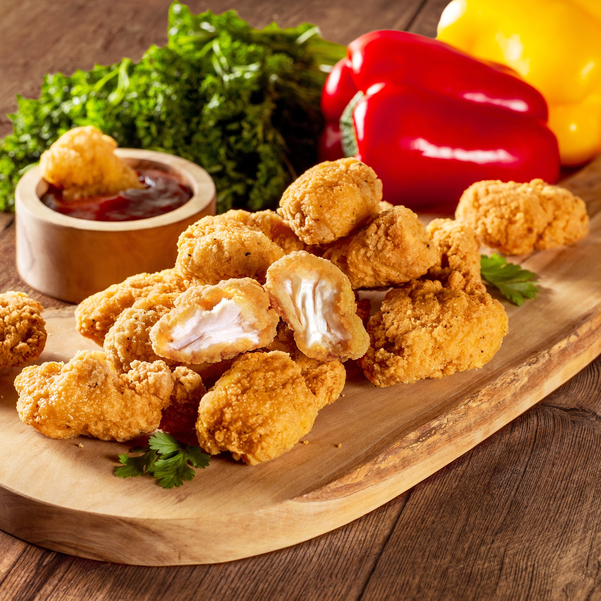 Erie Meats Jumbo Chicken Bites on a rustic style serving platter.